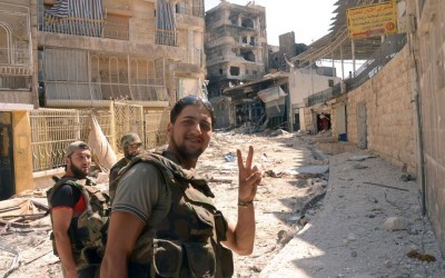 Syrian soldier flashes the V-sign for ..jpeg