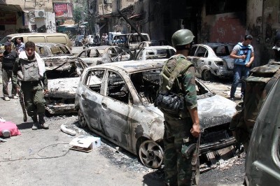 Syrian soldeirs celebrate in the al-Midan area in Damascus on July 20, 2012..jpg